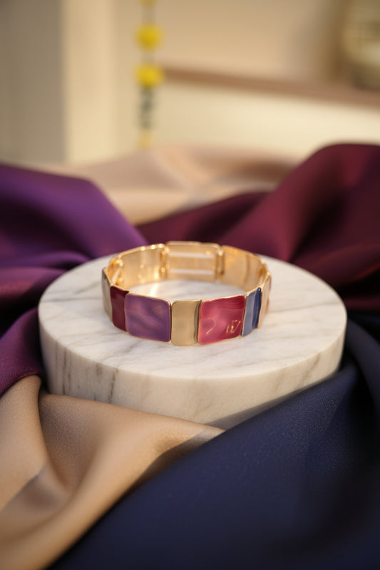 Gold bracelet with purple and red square stones