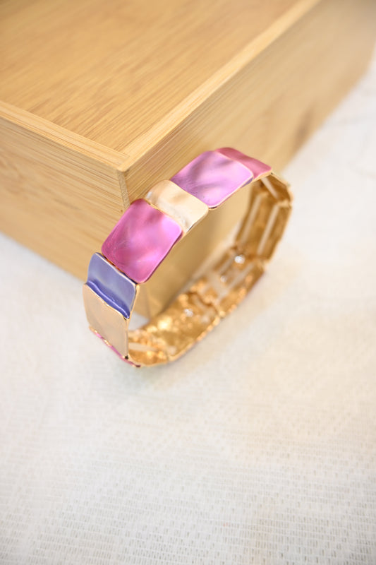 Gold bracelet with purple and red square stones